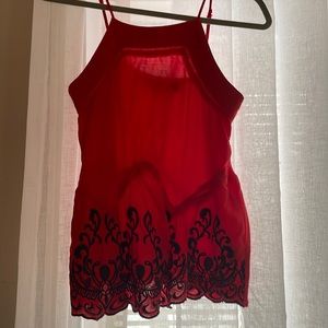 Orange/reddish top with blue lace unique designes.